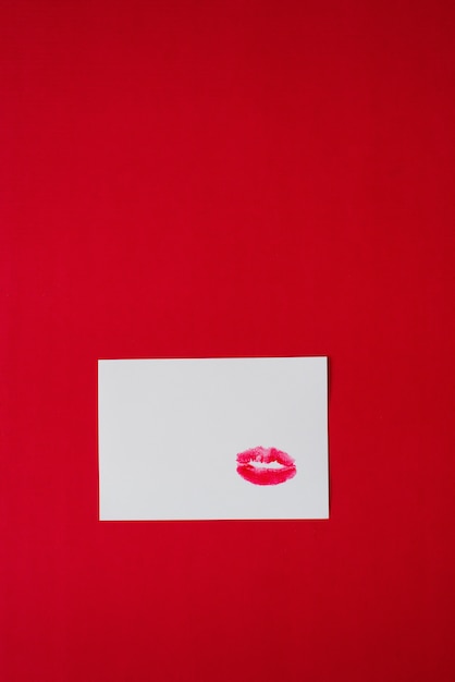 Photo lipstick marks kisses on white paper on red background