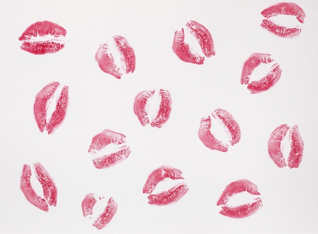 Lipstick marks on a white background solid background