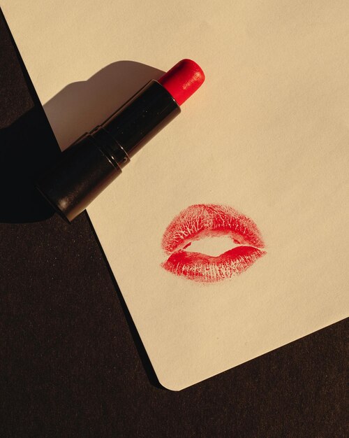 Photo lipstick on paper with red lipstick on it stock photo