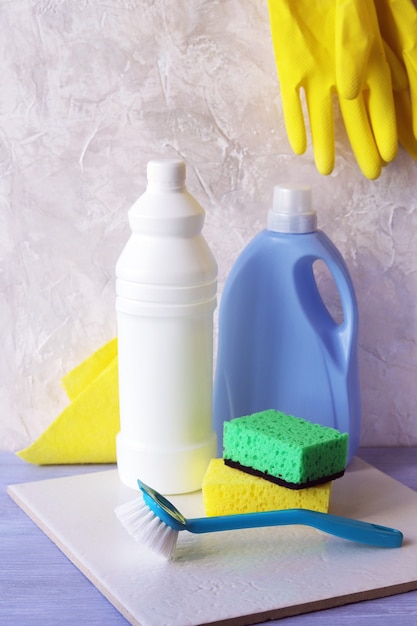 Liquid detergents in plastic bottles, packaging of home cleaning products on the  table