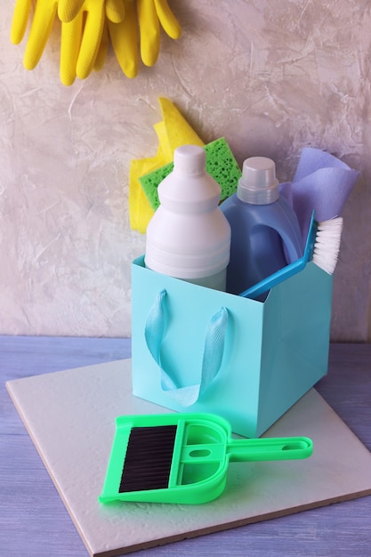 Liquid detergents in plastic bottles, packaging of home cleaning products on the table