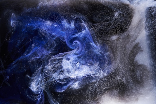 Liquid fluid art abstract background Black blue acrylic paint underwater galactic smoke ocean