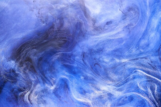 Liquid fluid art abstract background Blue acrylic paint underwater galactic smoke ocean