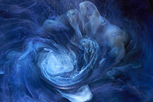 Liquid fluid art abstract background Blue acrylic paint underwater galactic smoke ocean