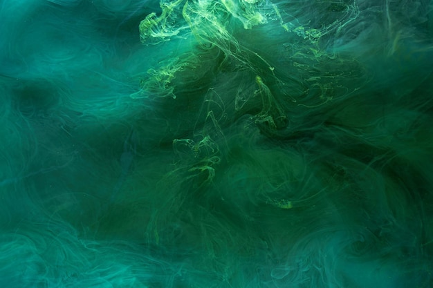 Liquid fluid art abstract background Blue green acrylic paint underwater galactic smoke ocean