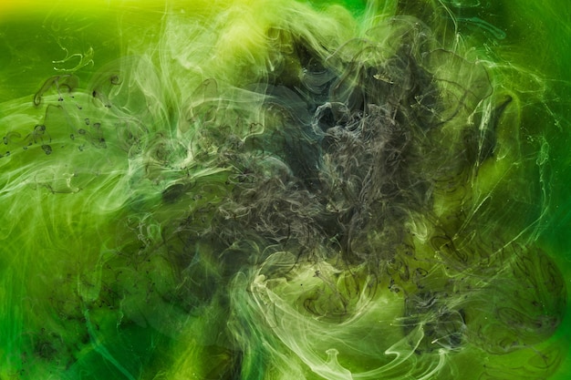 Liquid fluid art abstract background Green dancing acrylic paints underwater cosmic smoke ocean