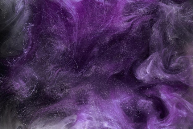 Liquid fluid art abstract background Mix of purple lilac dancing acrylic paints underwater space smoke ocean