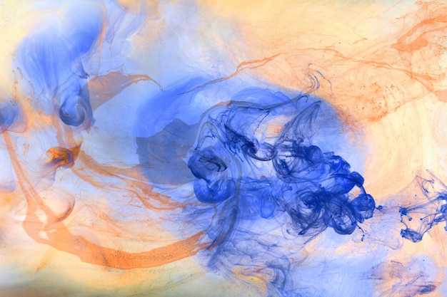 Liquid fluid art abstract background Orange blue acrylic paint underwater galactic smoke ocean