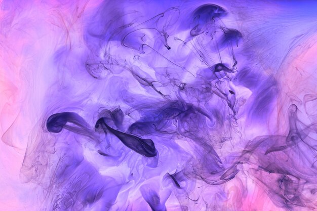 Liquid fluid art abstract background Pink blue acrylic paint underwater galactic smoke ocean