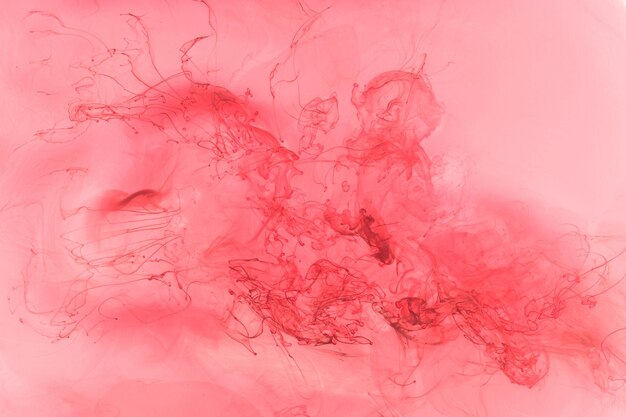 Liquid fluid art abstract background Pink dancing acrylic paints underwater ocean space smoke