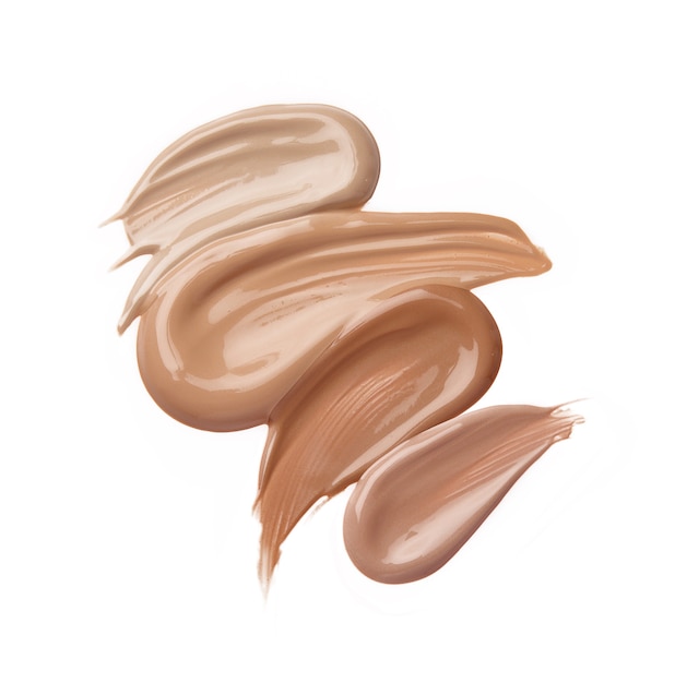 Liquid foundation strokes in different shades isolated on white