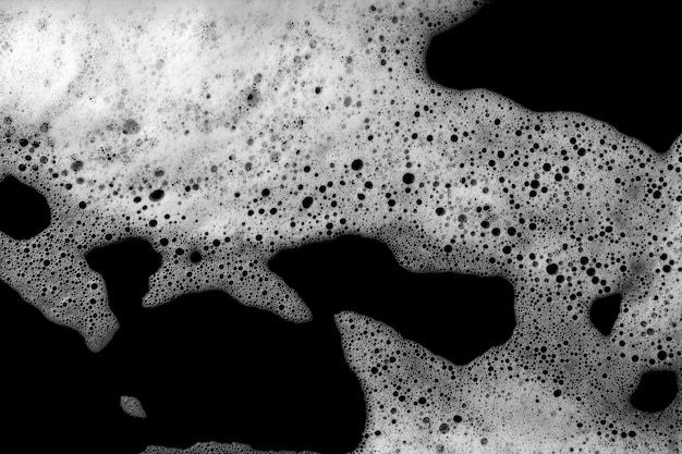 黒い背景に隔離された液体の白い泡泡