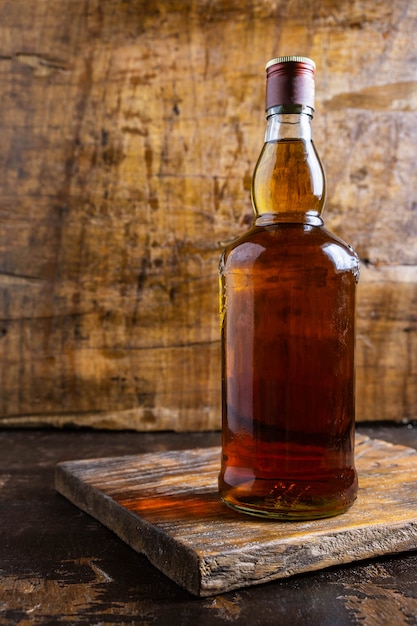 Liquor and liquor bottles on wooden table