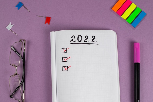 To do list for 2022 in notebook plan Top view flat lay copy space