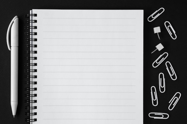 To do list and pen on black background. Back to school.