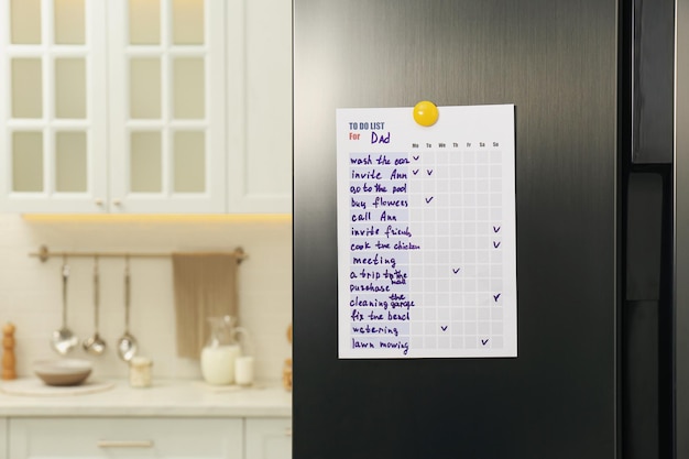 Photo to do list with magnet on refrigerator indoors space for text