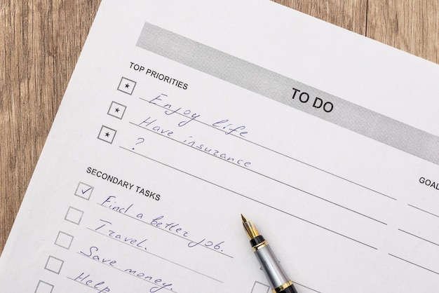 To do list with pen on desk