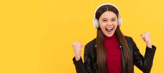 Listen to music wireless headset device accessory new technology Child portrait with headphones horizontal poster Girl listening to music banner with copy space