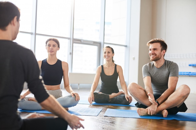 Listening to lecture at yoga seminar