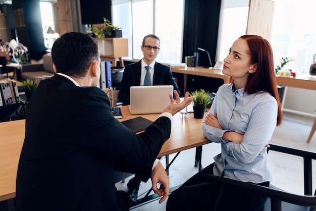 Listens to man in suit in lawyer's office Couple divorced