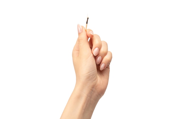 Lit match in a woman hand isolated on a white background Copy space