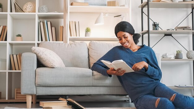 Photo literature lifestyle favorite book young relaxed happy woman enjoying reading interesting novel