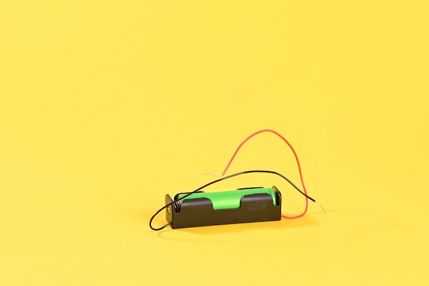 Lithium battery on yellow background