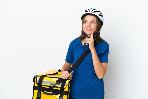 Lithuanian woman with thermal backpack thinking an idea while looking up