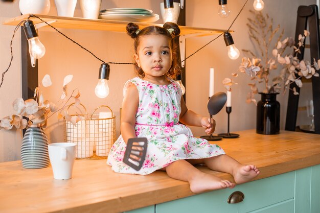 little african American girl in the kitchen at home