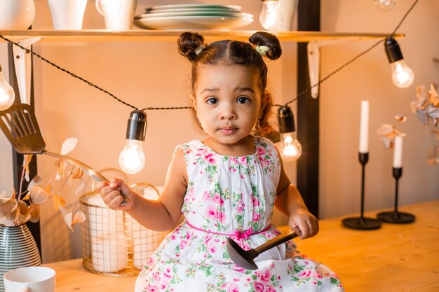 little african American girl in the kitchen at home