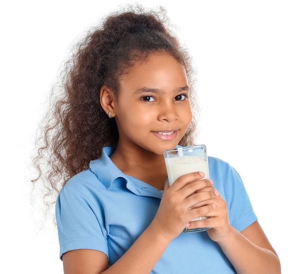 Little African-American girl with milk on white