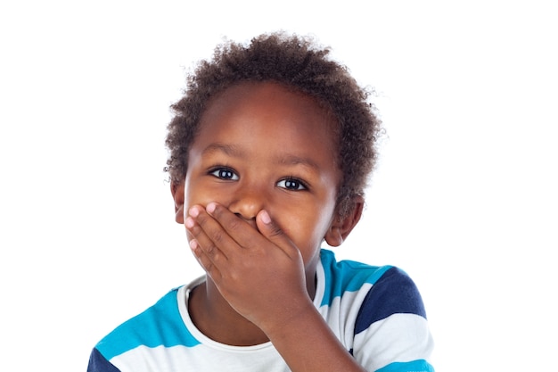 Little african boy covering his mouth