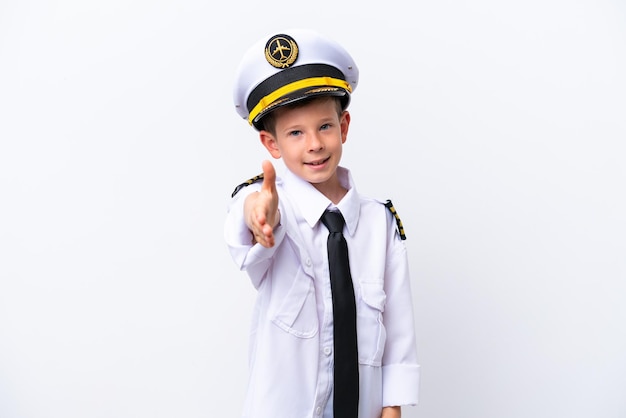 Little airplane pilot boy isolated on white background shaking hands for closing a good deal