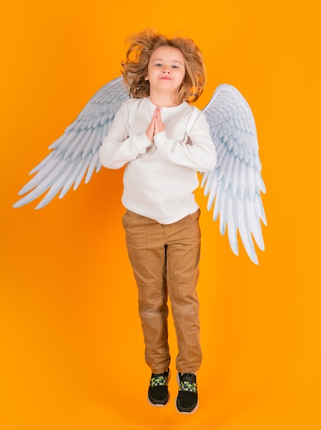 Little angel jump kids jumping full body Valentine's day Blonde cute child with angel wings 