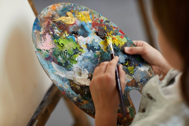 little artist holding palette