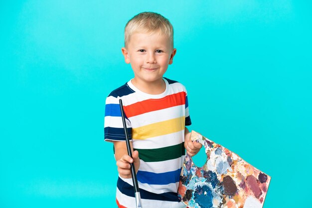 Little artist Russian boy over isolated background