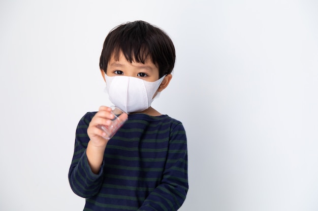 Little Asian boy with health mask protect virus on white