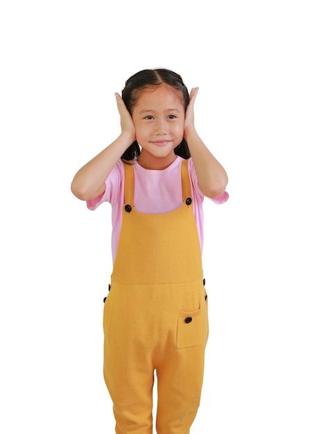 Little Asian girl child closing ears with both hands, avoid listening noise. Child covering his ears with looking out isolated on white background.