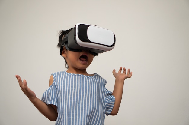 Little asian girl child with virtual reality headset