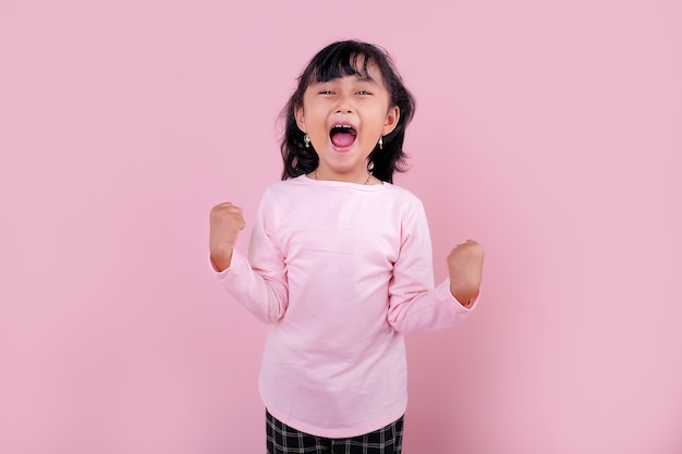 little Asian girl in pink blouse shouting