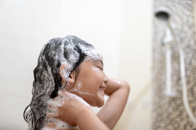 Little Asian girl take a bath