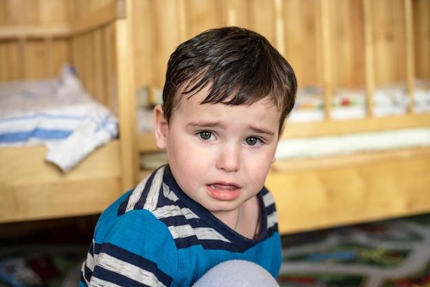 Little baby boy sad in the nursery