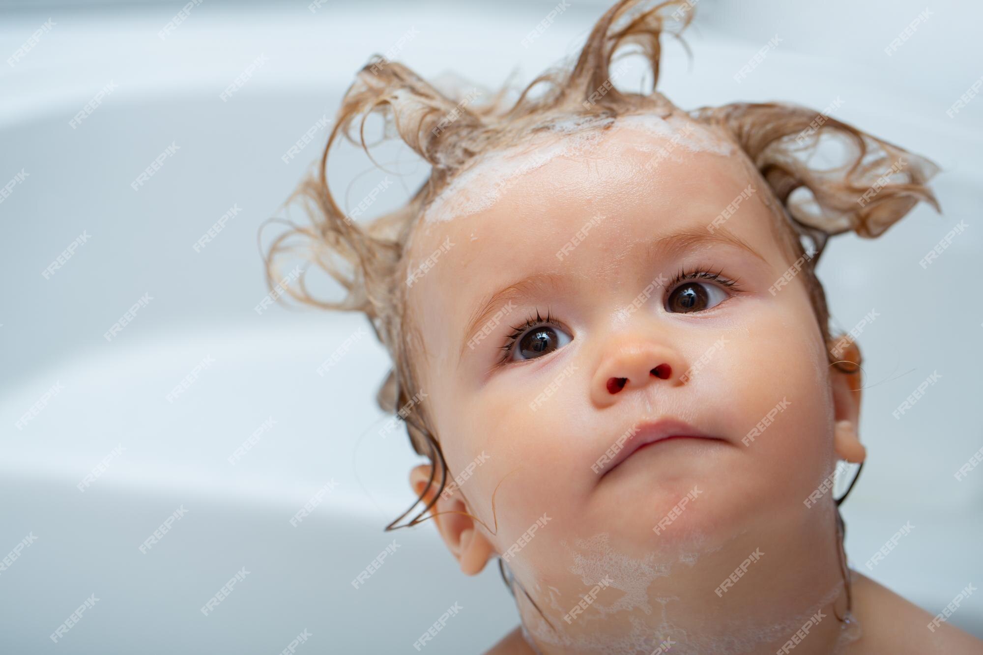 Premium Photo | Little baby child is washing her hair in bath funny kids  face closeup