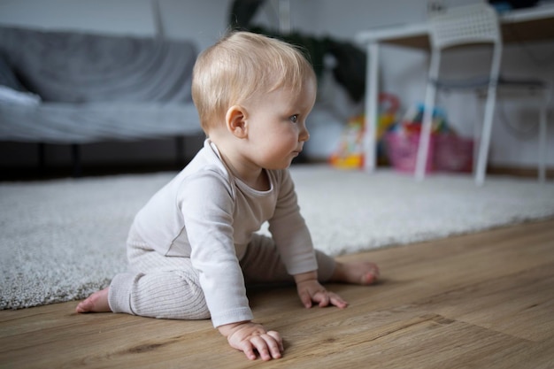 little baby crawling on the floor