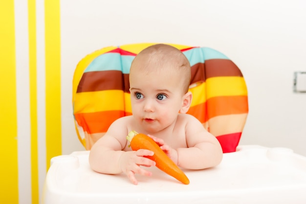 Little Baby Eating a Carrot