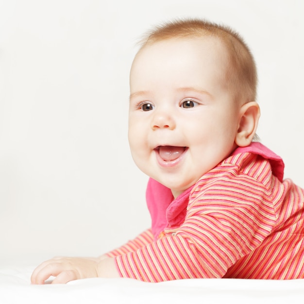 Little baby girl wearing a red clothes