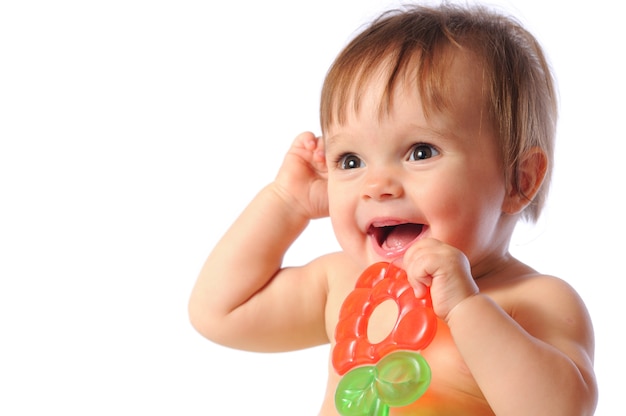 Little baby holding colorful teething toy