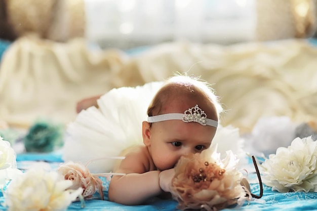 The little baby is lying on the crib Newborn