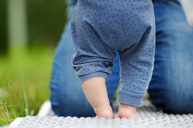 Little baby learning to stand or to walk