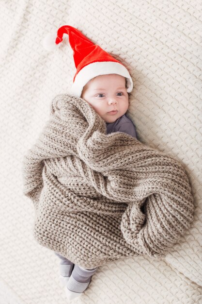 Little baby in red santa hat